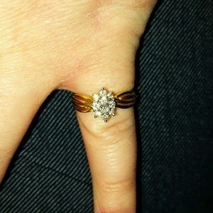 14K gold ring with 10 small diamonds.